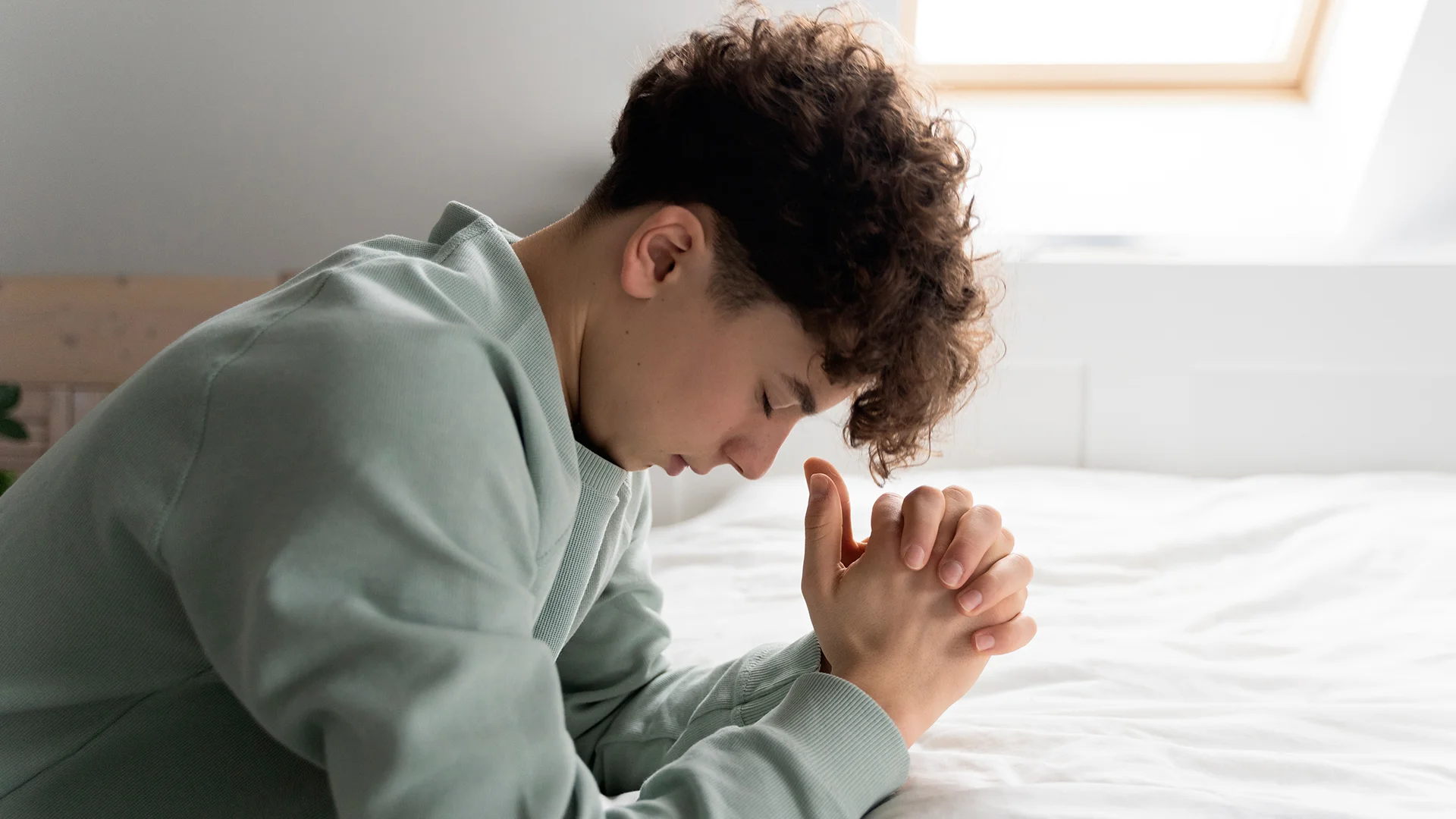 Close up on kid praying